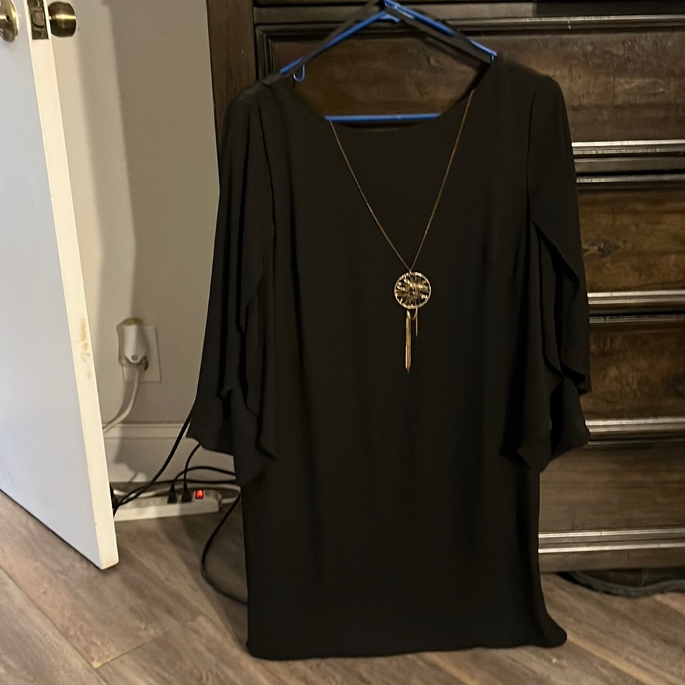 Knee length black dress, worn twice. Size medium